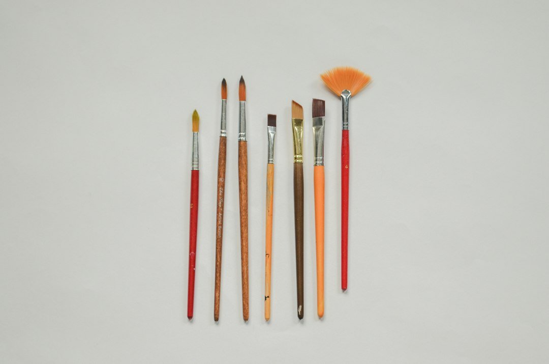 a group of paint brushes sitting next to each other