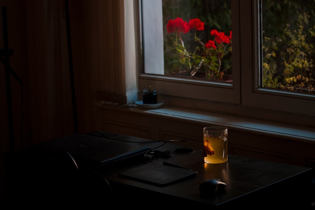 a glass of water on a desk